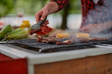 Image showing man cooking tasty food for french dinner party