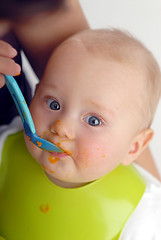 Image showing Feeding of a small child