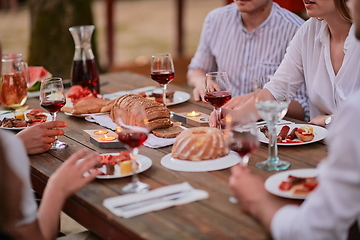 Image showing friends having picnic french dinner party outdoor during summer holiday