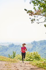 Image showing woman enjoying in a healthy lifestyle while jogging