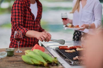 Image showing man cooking tasty food for french dinner party