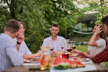 Image showing friends having picnic french dinner party outdoor during summer holiday