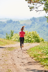 Image showing woman enjoying in a healthy lifestyle while jogging