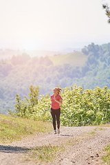 Image showing woman enjoying in a healthy lifestyle while jogging