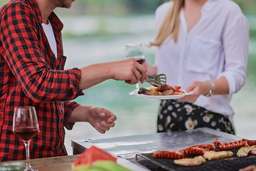 Image showing man cooking tasty food for french dinner party