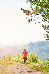 Image showing woman enjoying in a healthy lifestyle while jogging