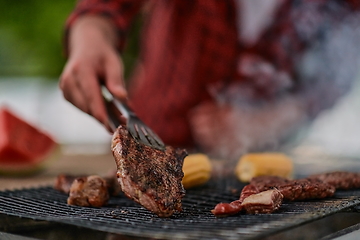 Image showing man cooking tasty food for french dinner party