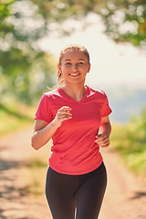 Image showing woman enjoying in a healthy lifestyle while jogging