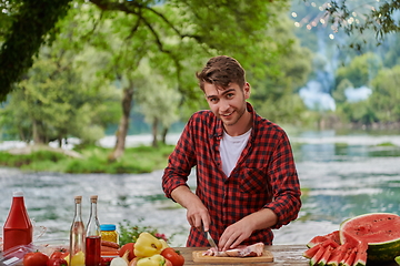 Image showing man cooking tasty food for french dinner party