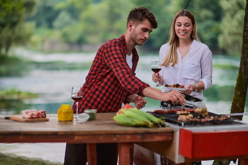 Image showing man cooking tasty food for french dinner party