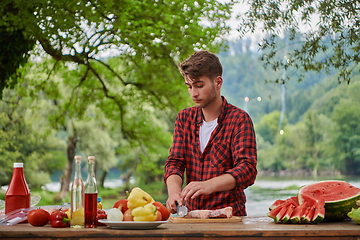 Image showing man cooking tasty food for french dinner party