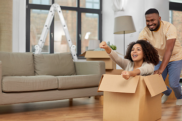 Image showing happy couple moving to new home and having fun