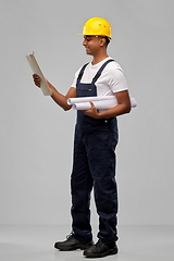 Image showing happy indian builder with blueprint and clipboard