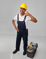 Image showing happy worker or builder making phone call gesture