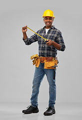 Image showing happy indian worker or builder with ruler