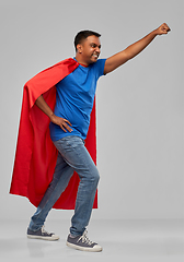 Image showing indian man in superhero cape makes winning gesture