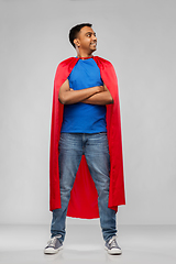 Image showing happy smiling indian man in red superhero cape