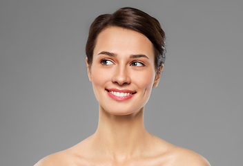 Image showing beautiful smiling young woman with bare shoulder