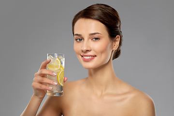 Image showing woman drinking water with lemon and ice