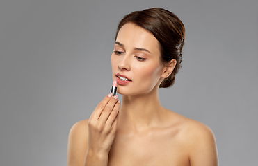 Image showing beautiful smiling young woman with pink lipstick