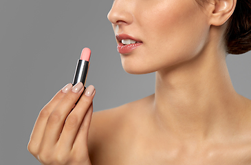 Image showing beautiful smiling young woman with pink lipstick