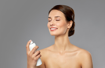 Image showing beautiful young woman with facial spray or mist