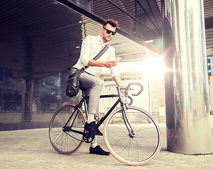 Image showing man with bicycle and smartphone on city street