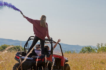 Image showing  colorful torches while driving a off road buggy car