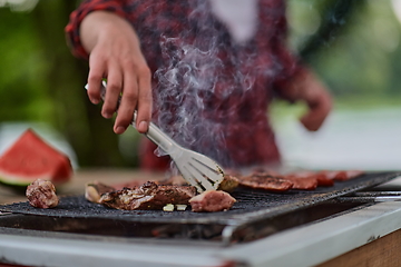 Image showing man cooking tasty food for french dinner party