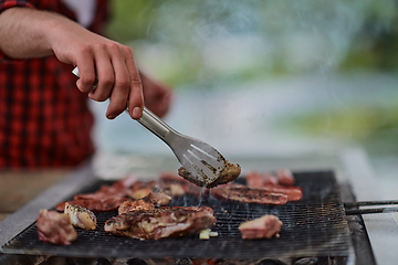 Image showing man cooking tasty food for french dinner party