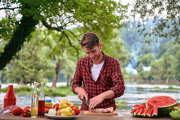 Image showing man cooking tasty food for french dinner party