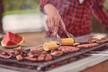 Image showing man cooking tasty food for french dinner party