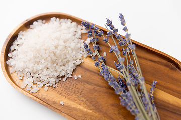 Image showing sea salt heap and lavender on wooden tray