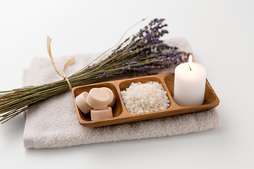 Image showing sea salt, soap, candle and lavender on bath towel