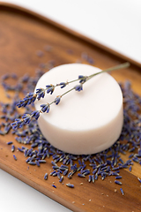 Image showing close up of crafted lavender soap on wooden tray