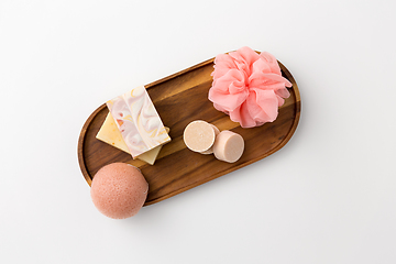 Image showing crafted soap, sponge and wisp on wooden tray