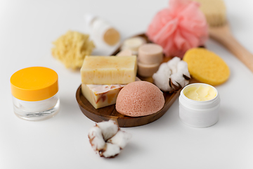 Image showing crafted soap, sponge and wisp on wooden tray