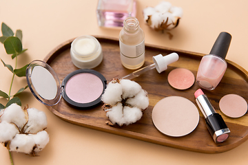 Image showing makeup, perfume and cosmetics on wooden tray