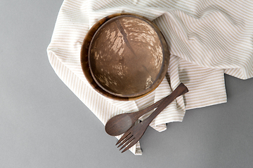 Image showing close up of coconut bowl, wooden spoon and fork