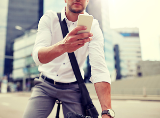 Image showing man with smartphone and fixed gear bike on street