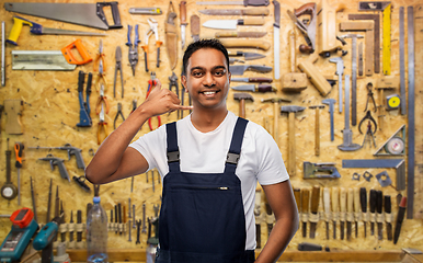 Image showing happy worker or builder making phone call gesture