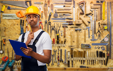 Image showing thinking builder with clipboard and pencil