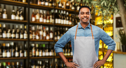 Image showing smiling indian barman or waiter at wine bar