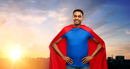 Image showing happy smiling indian man in red superhero cape