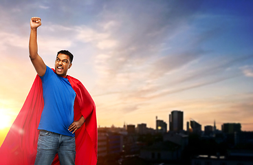 Image showing indian superhero makes winning gesture in city