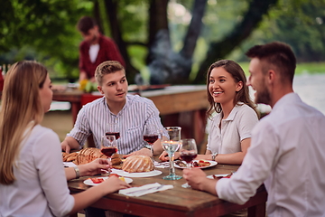 Image showing friends having picnic french dinner party outdoor during summer holiday