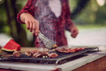 Image showing man cooking tasty food for french dinner party