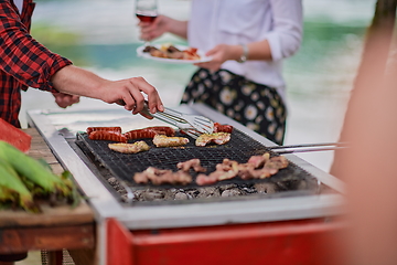 Image showing man cooking tasty food for french dinner party