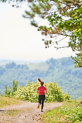 Image showing woman enjoying in a healthy lifestyle while jogging