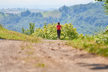 Image showing woman enjoying in a healthy lifestyle while jogging